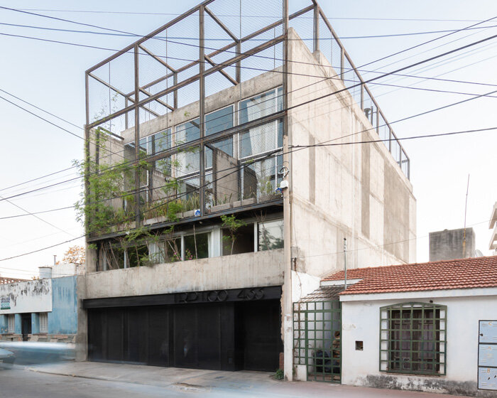 three vertical houses compose concrete 'triptico' building in córdoba, argentina