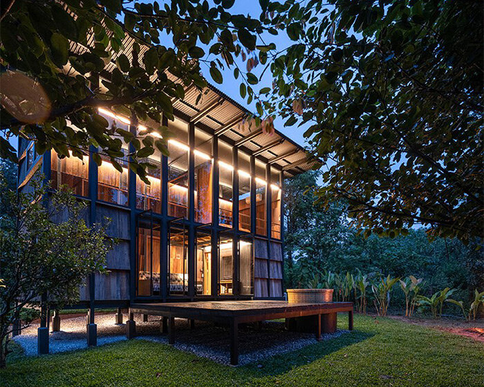 off-grid timber cabin connects travelers to the mountainous landscape of thailand