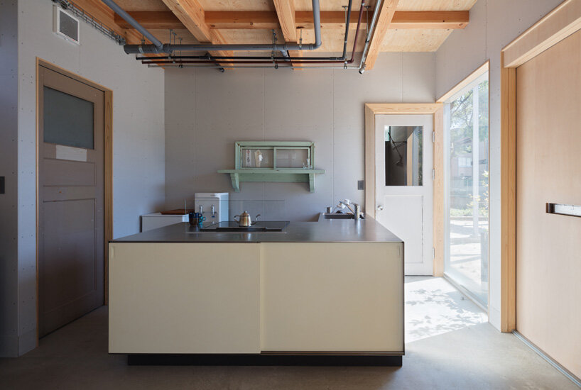 yHa architects rebuilds a historic façade for new office in fukuoka, japan 