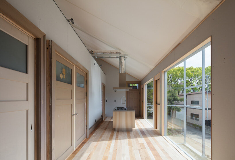 yHa architects rebuilds a historic façade for new office in fukuoka, japan 