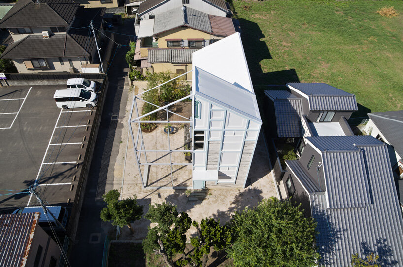 yHa architects rebuilds a historic façade for new office in fukuoka, japan 