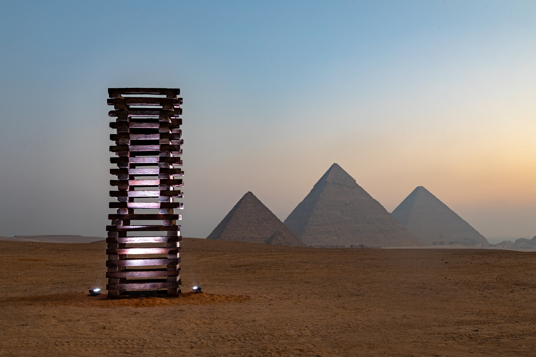 mummified robot joins JR at egypt's first art exhibition at giza pyramids