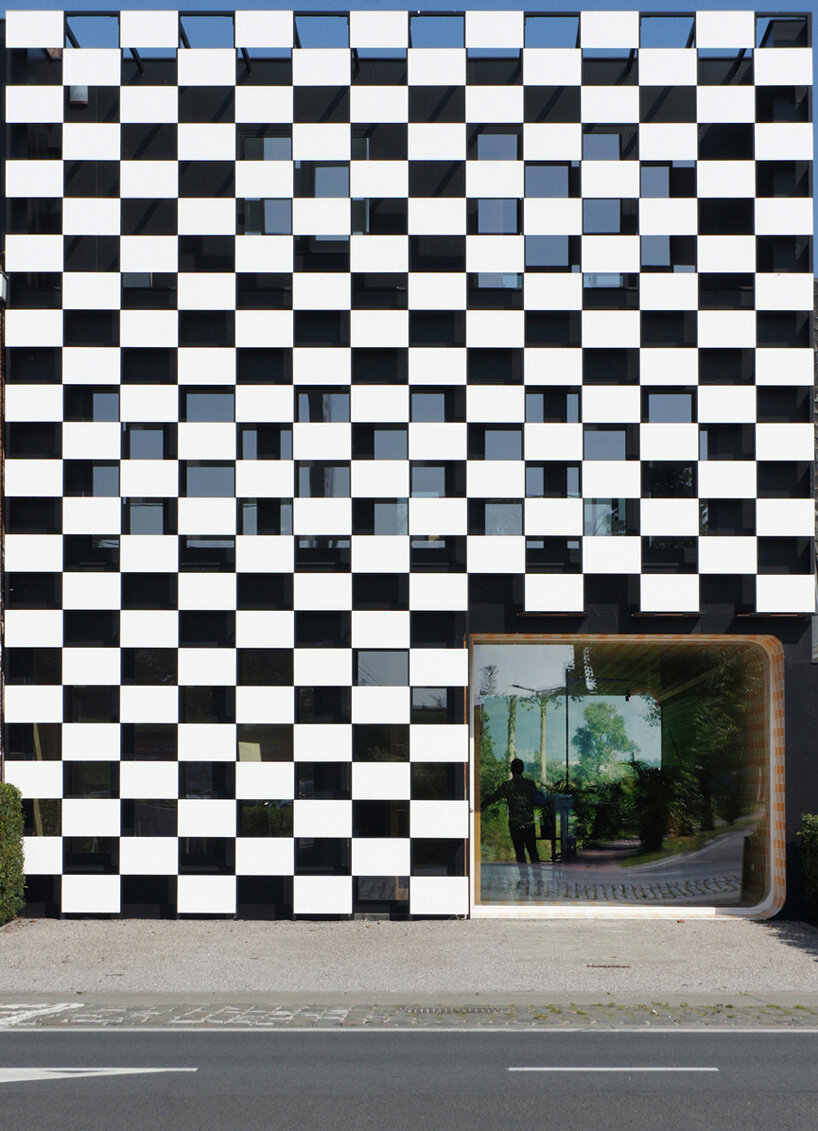 checkered office building in belgium is designed to 'stand out from the crowd'
