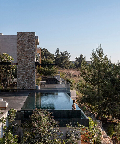 dana oberson architects completes contemporary stone villa in neve ilan, israel
