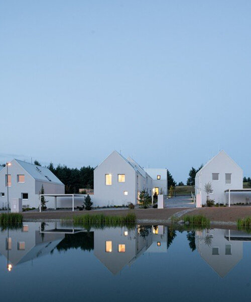 monom architects builds village-like housing complex in the czech republic