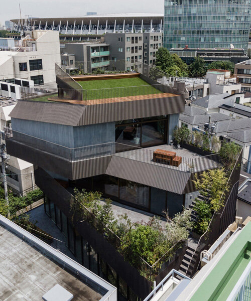 fortress-like residential building with irregular green terraces stands out in tokyo