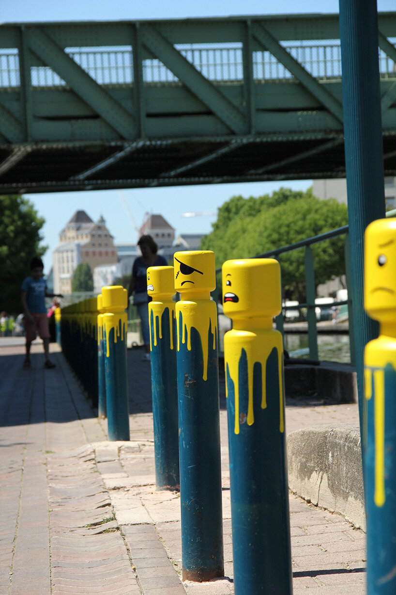 urban artist le cyklop unleashes angry one-eyed LEGOs in the streets of france