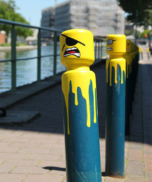 urban artist le cyklop unleashes angry one-eyed LEGOs in the streets of france