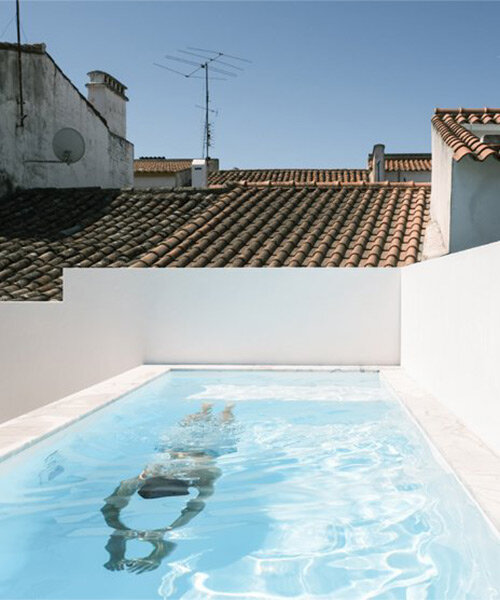 sunny patio with pool becomes the protagonist of 19th-century house renovation in portugal