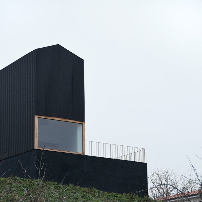 black corrugated metal clads récita architecture's slender house in rural france