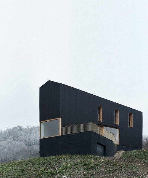 black corrugated metal clads récita architecture's slender house in rural france
