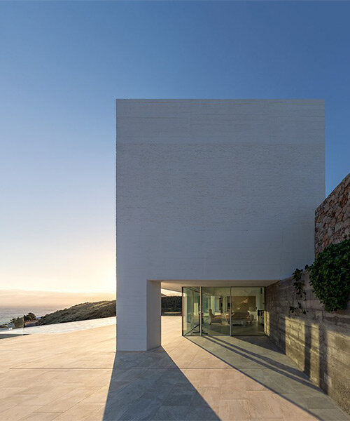 robust concrete pillars support minimalist 'jacaranda house' by JFGS architects in spain