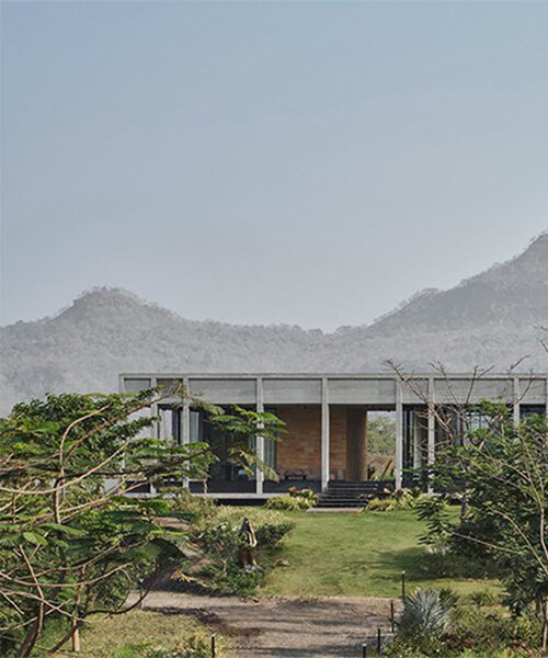 this concrete farmhouse emerges as a gateway cabin in karjat, india