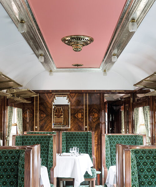 wes anderson revives 1950s train carriage inviting visitors into whimsical film sets