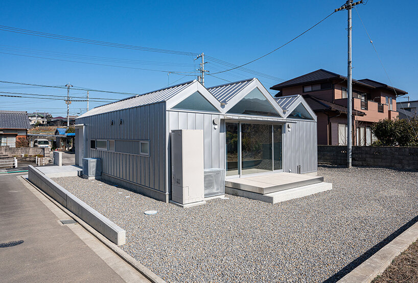 yusuke ando architects completes a 'house of six lightened ceilings' in japan