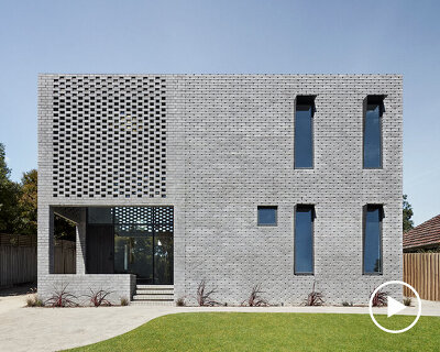 LLDS wraps its 'cuboid house' with a robotically-generated envelope of grey brickwork