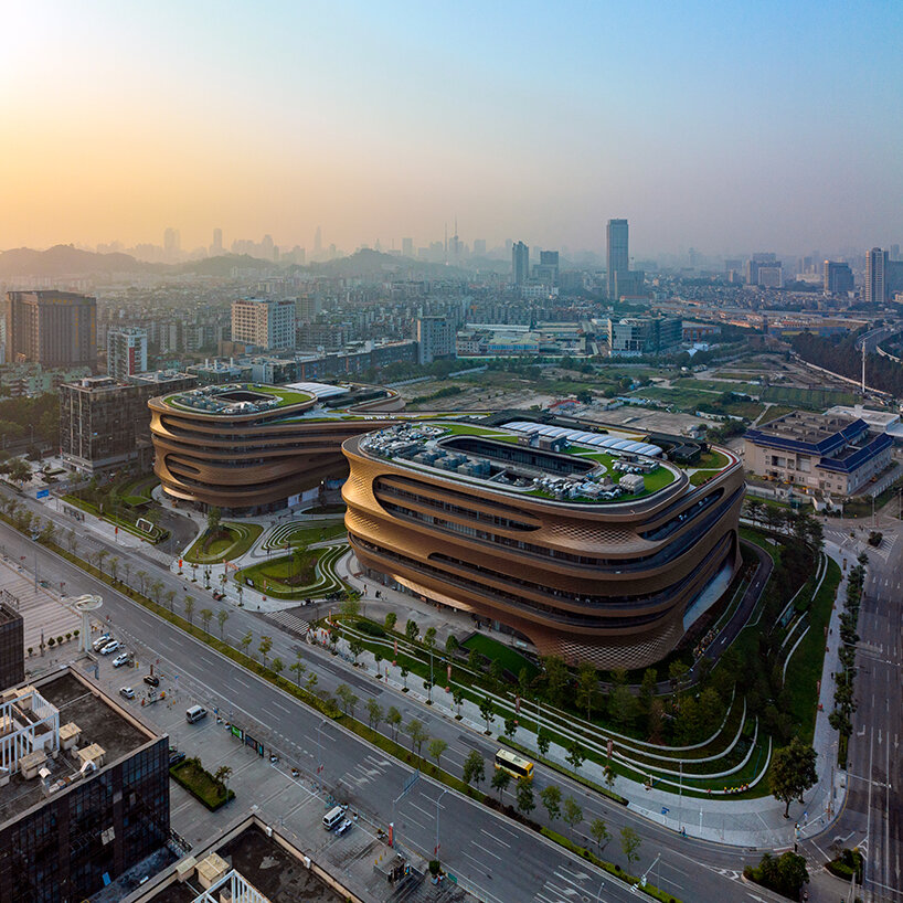 zaha hadid architects' fluid infinitus plaza takes shape as an infinity ...