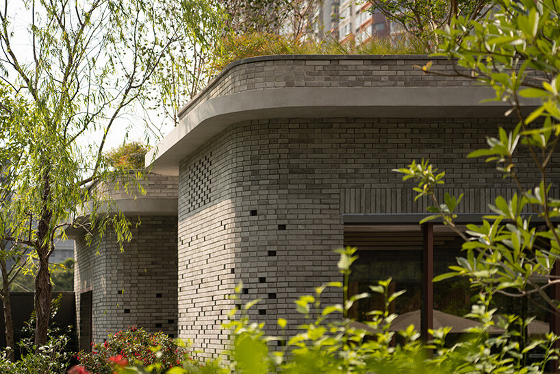 curved brickwork reinterprets chinese vernacular architecture in hong kong residence by via.