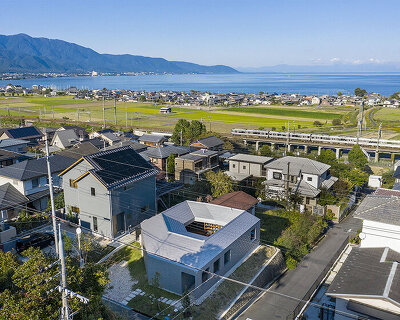 this house organized around a courtyard is designed for a dog lover