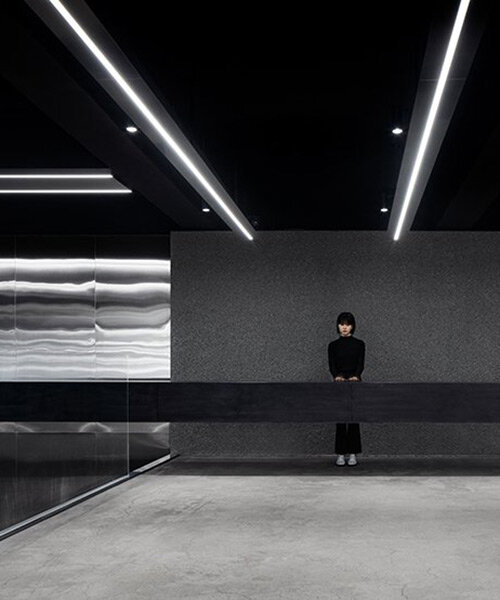 linear floating elements and reflective surfaces form this retail store in south korea