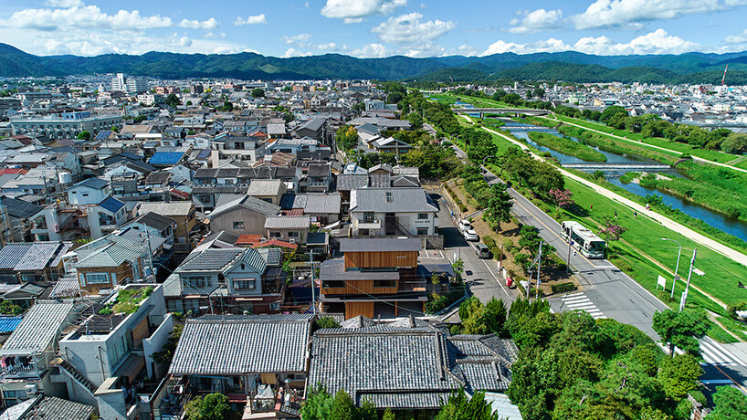 tomohiro hata shapes house in shimogamo, japan, as an arrangement of overlapping roofs