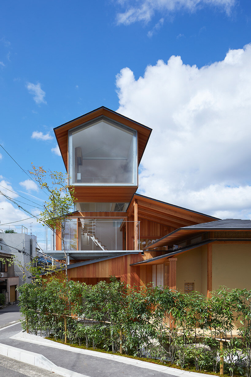 tomohiro hata shapes house in shimogamo, japan, as an arrangement of overlapping roofs