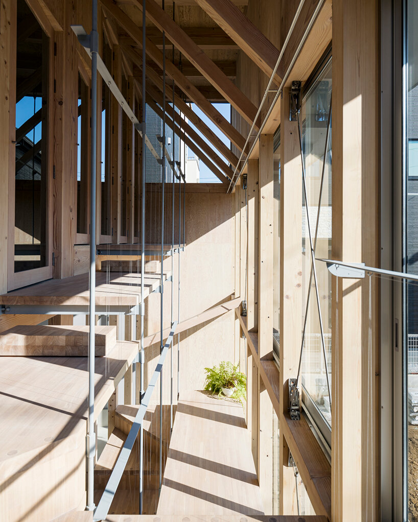 KIRI architects opens up this compact japanese house with a light-filled stair hall