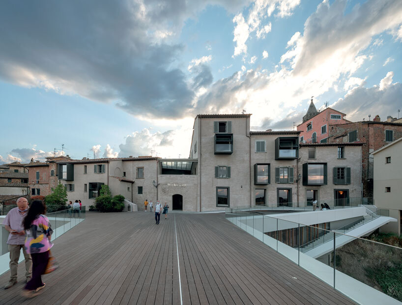 mario cucinella revives an italian hill town with cantilevered cultural center