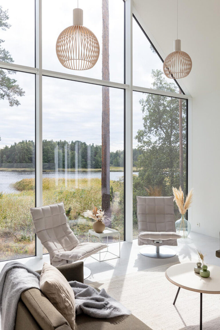 pirinen & salo sets threevolume charred wood house between pine trees