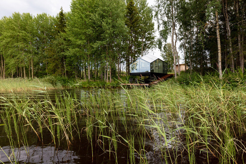 mirrored glass cabin by pirinen & salo disappears into finland's rich natural landscape