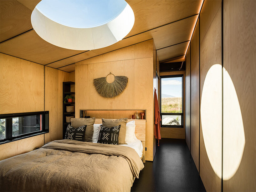 barry connor design's 50sqm cabin retreat in new zealand echoes the aerial dance of birds