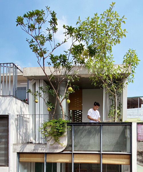 this narrow, five-storey vietnamese residence adapts to extreme urban density