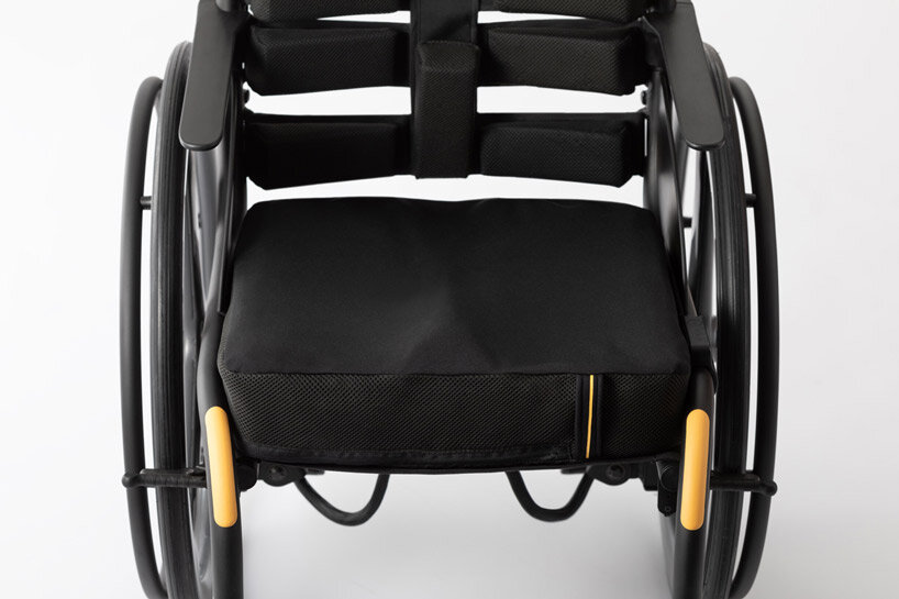 the wheeliy foldable wheelchair features yellow accents for intuitive handling