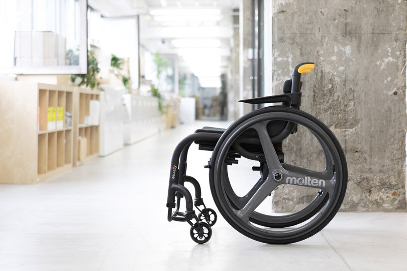 the wheeliy foldable wheelchair features yellow accents for intuitive handling