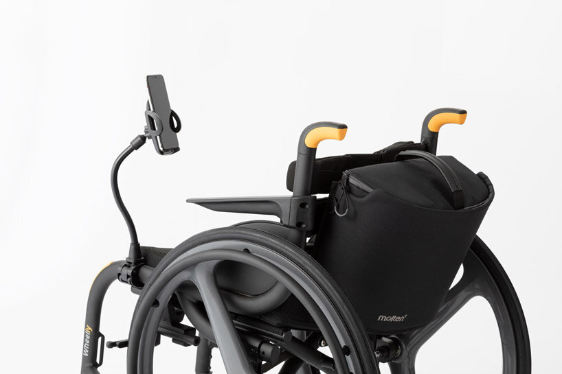 the wheeliy foldable wheelchair features yellow accents for intuitive handling