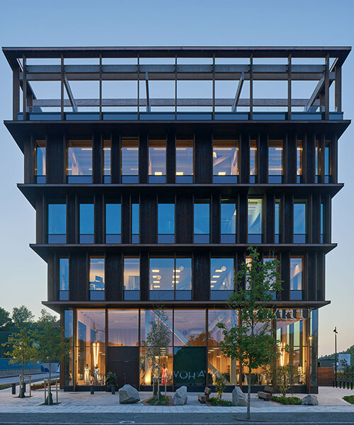 white arkitekter's nodi office building in sweden rises inside staggered wooden framework