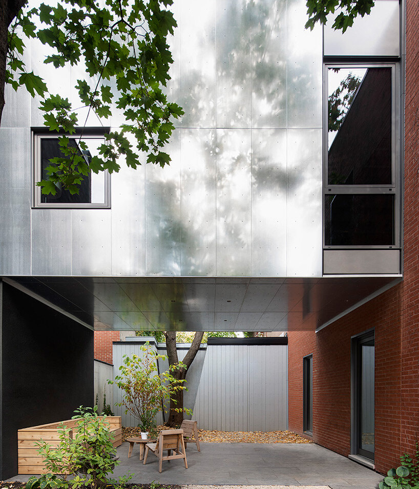 T B A bridges century-old carriage home with a floating extension in montréal