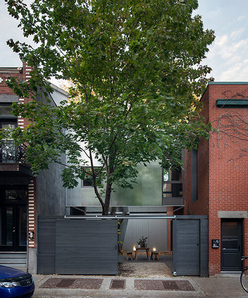 T B A bridges century-old carriage home with a floating extension in montréal
