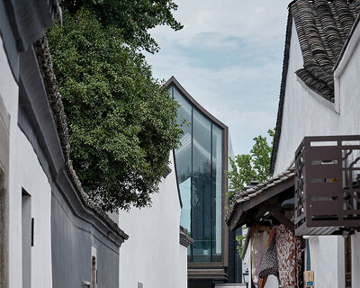 ACRC's art museum with sloping roofs and extended glazing revives ancient city in china
