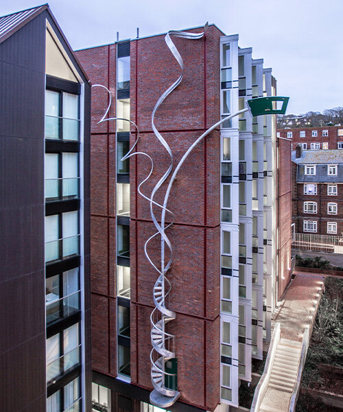 alex chinneck unveils 25-meter-high spiraling sculpture in brighton, uk