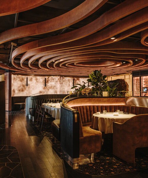 sculptural wooden ceiling tops astet studio's leña marbella restaurant in spain
