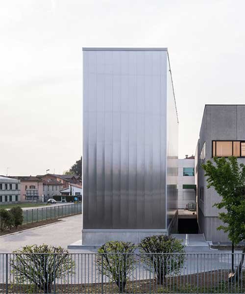 this automated warehouse in italy oscillates between opacity and transparency
