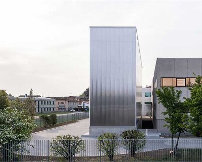 this automated warehouse in italy oscillates between opacity and transparency