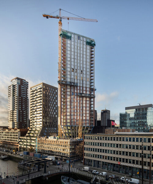 rotterdam's first triangular tower tops out in the city's maritime district