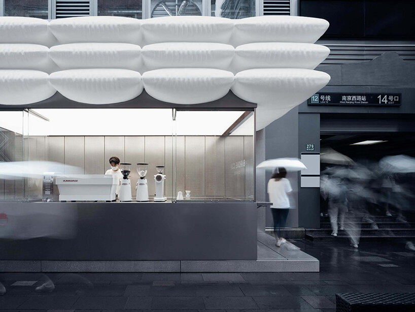 F.O.G. architecture's birdie cup coffee is nested beneath a roof of floating white puffs