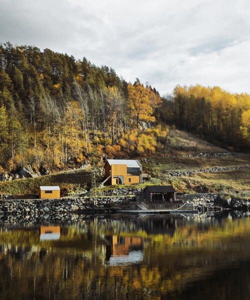 a slanted beam supports this fjord-side cabin in western norway