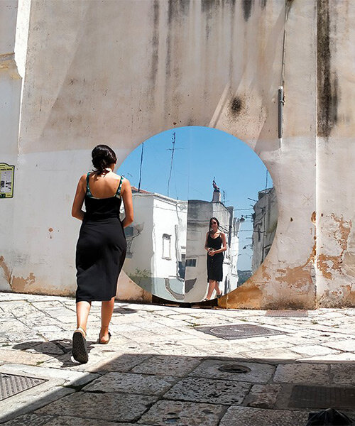 circular reflective installation by studio sifr reinvents urban perception in noci, italy