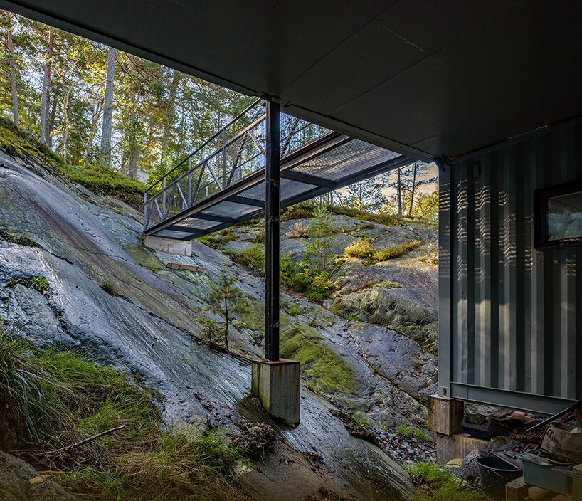 måns tham stacks eight shipping containers to build a private residence in sweden