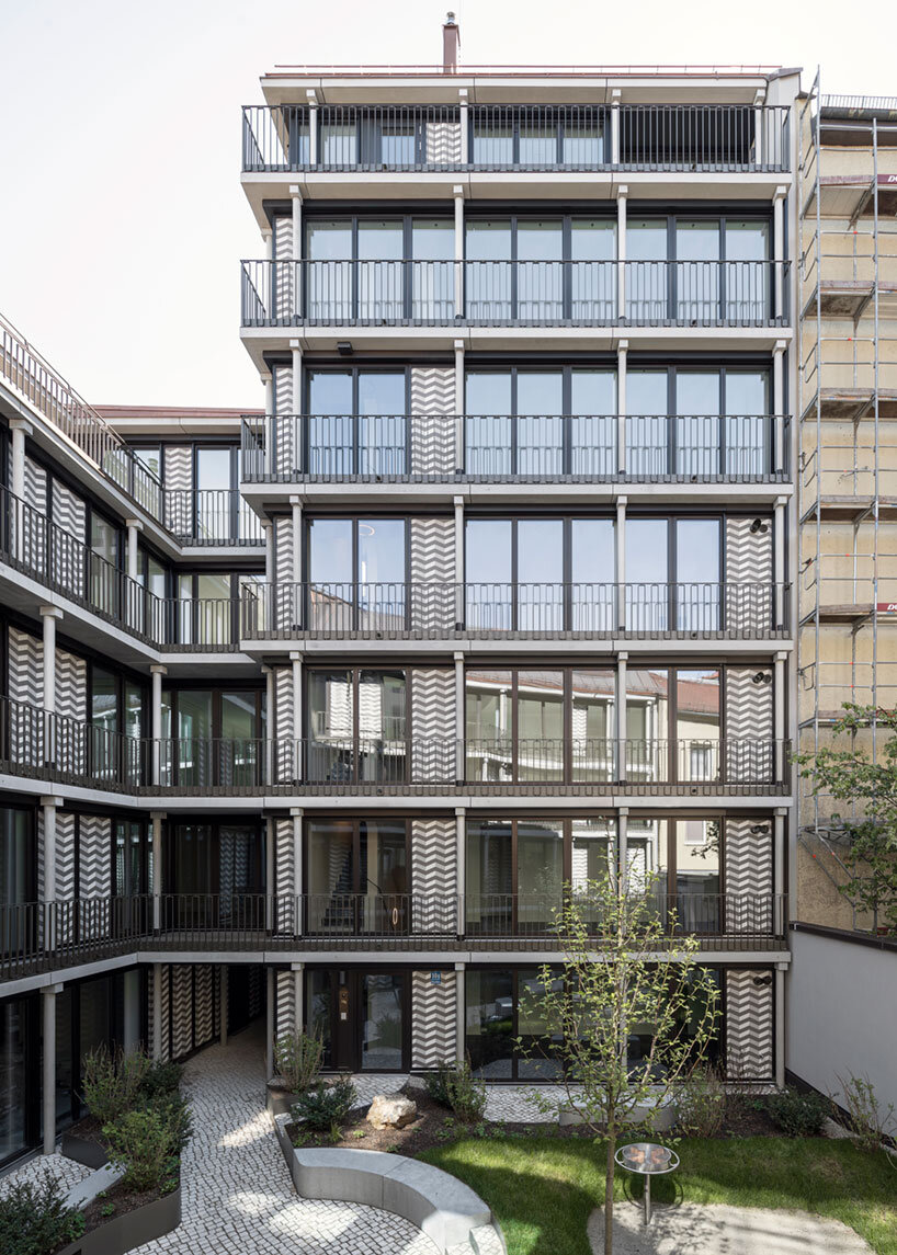 thomas kröger architekten wraps his munich apartments in a graphic pattern