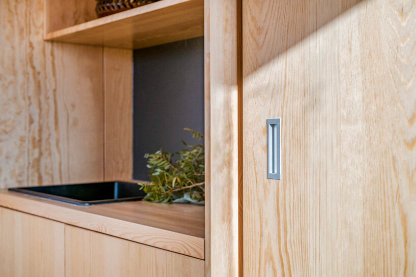 hello wood elevates wauhaus cabin on legs of different lengths in hungary